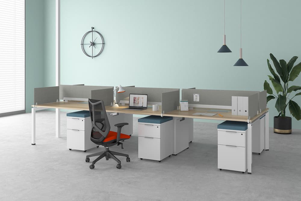 Friant Verity workstations with light wood desktops, privacy screens, and integrated storage in a bright office