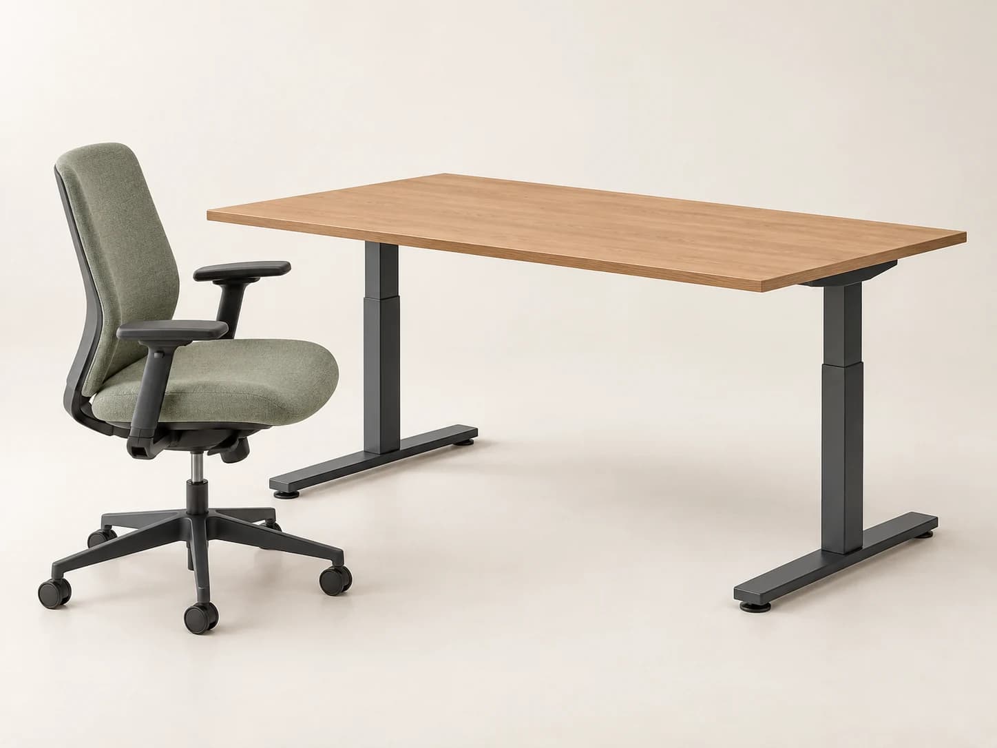 A complete oak desk and sage task chair workspace