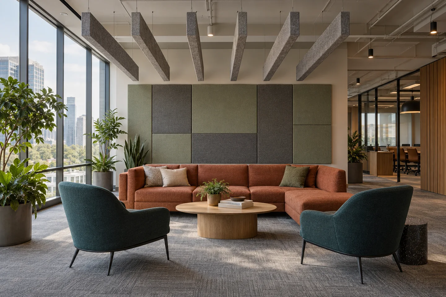 Commercial lounge with suspended felt ceiling baffles, upholstered acoustic wall panels and carpet tile